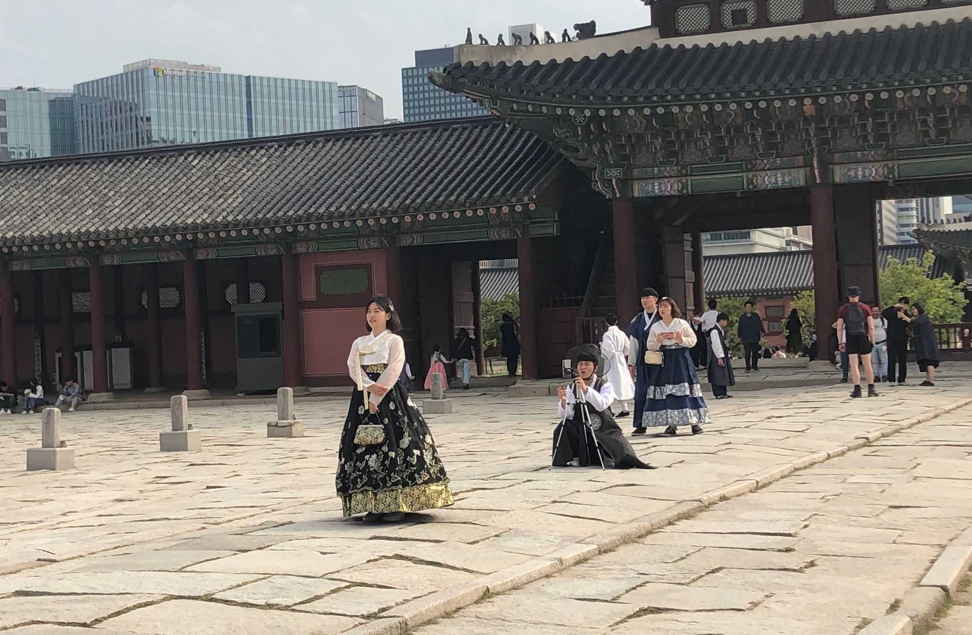 Girls in traditional costume like to be photographed from the back (Image by author)