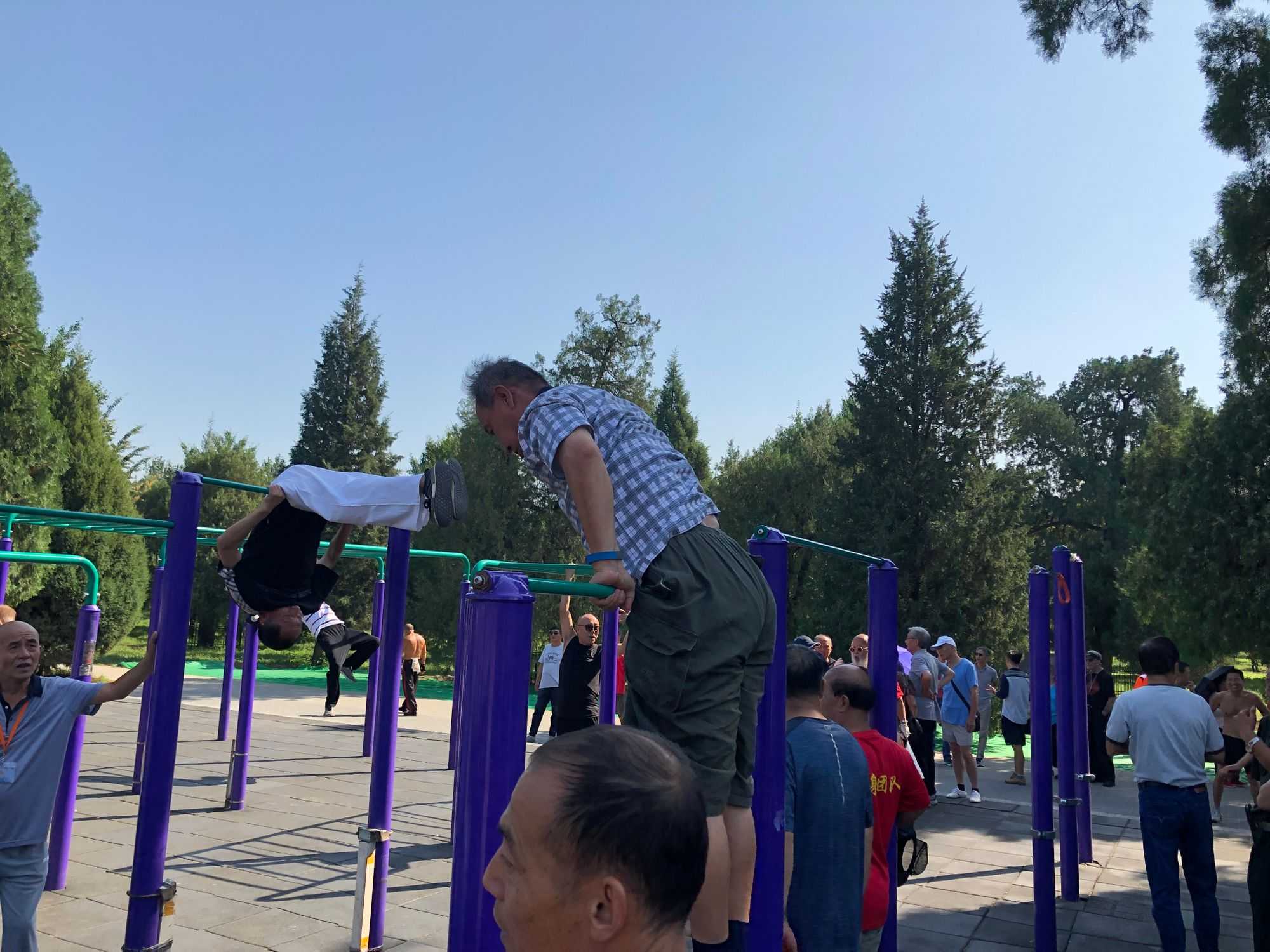 Temple of Heaven Park. Elderly gymnasts with amazing skills. (Image by author)
