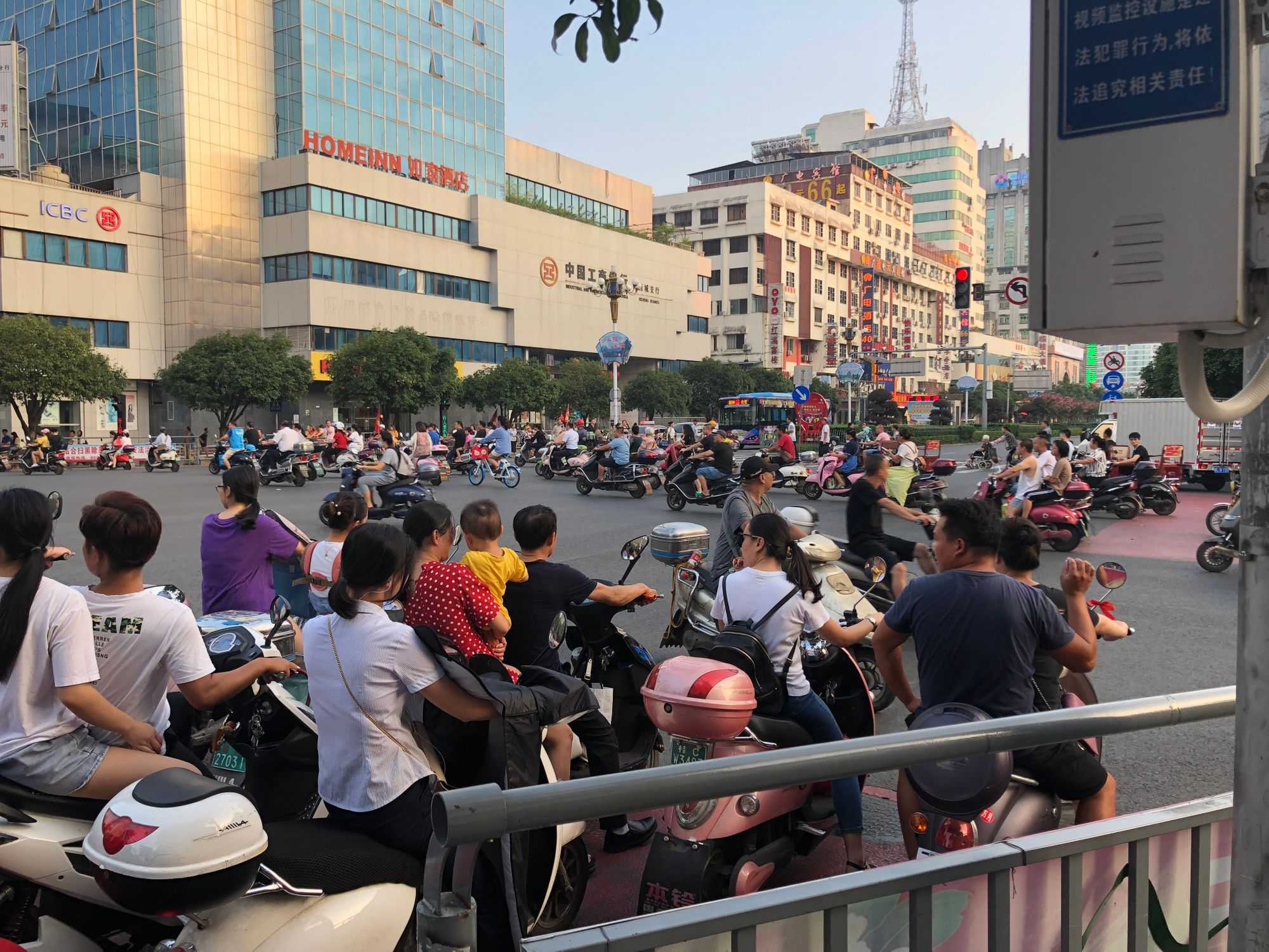 Busy Guilin street - Motorcycles coming in all directions (Image by author)